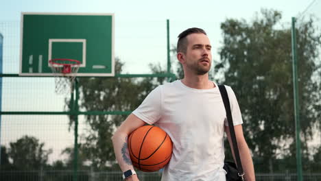 man with basketball on court