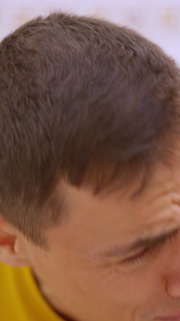 Man sitting on toilet having realized there is no toilet paper