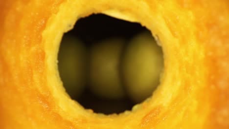 quickly pushing through the interior of an apple core that is heavily oxidized