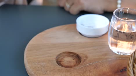 turkish coffee and water on a wooden tray