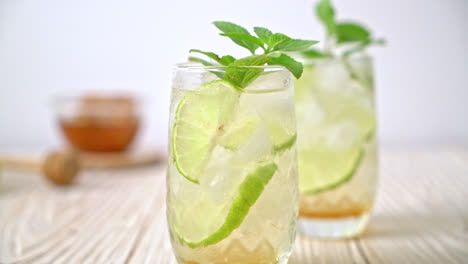 iced honey and lime soda with mint - refreshing drink