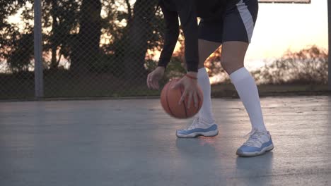 Close-Up-Footage-Of-A-Young-Girl-Basketball-Player-Training-And-Exercising-Outdoors-On-The-Local-Court-2