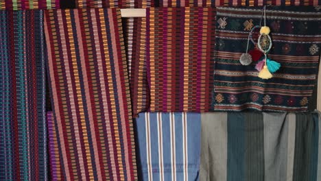 traditional textiles hand-weaved by indigenous woman at mayan village in zinacantan, chiapas, mexico