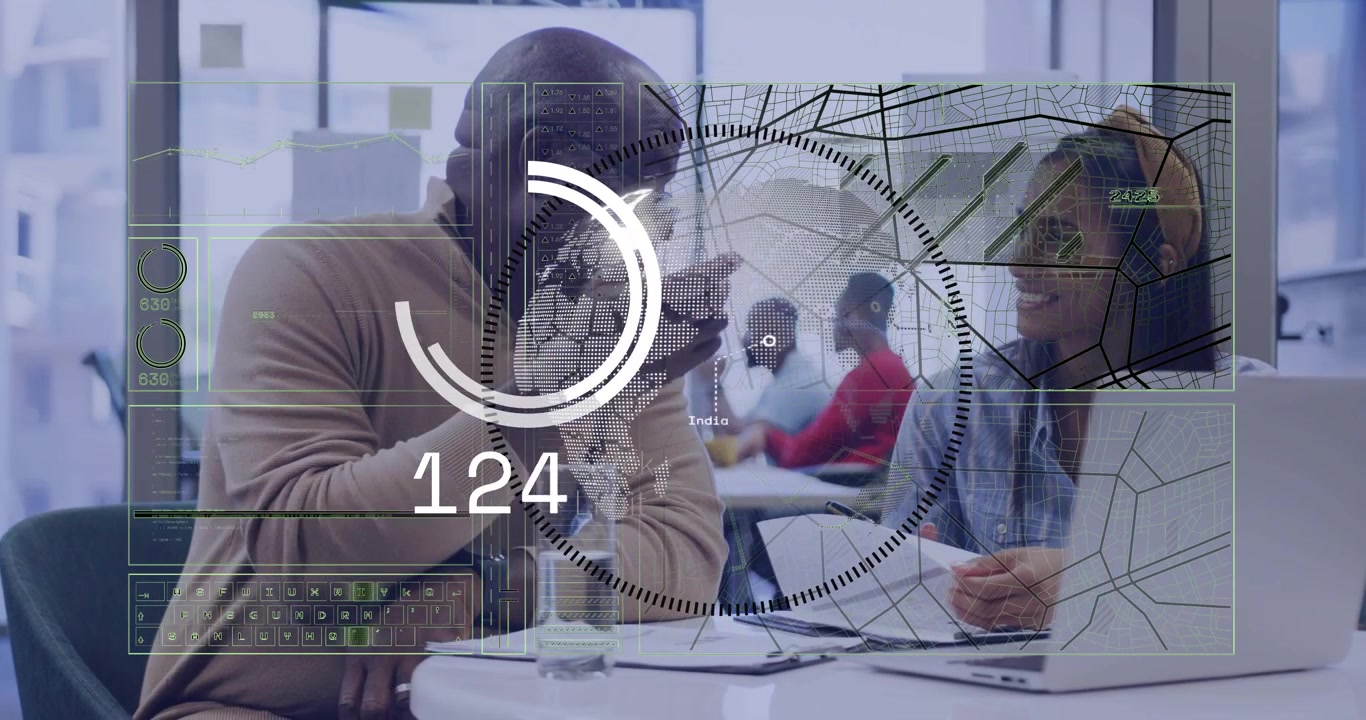 On man leaning in and pointing, woman rotating papers and reviewing, HUD animating business data