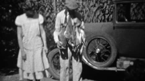 1934: man wearing necklace of hunted dead geese around neck.