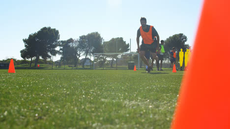 football player practicing in the field 4k