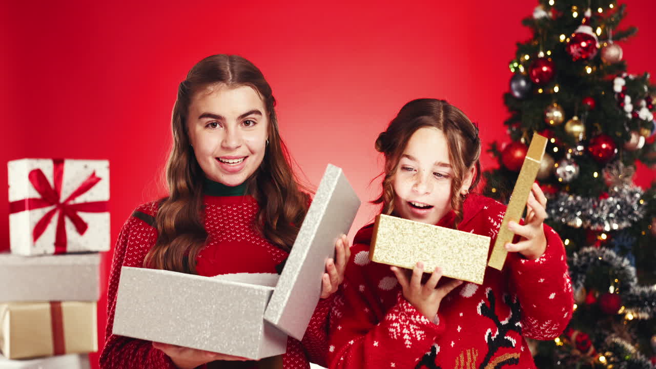 Children opening gifts for christmas