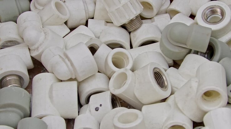 Many White Pvc Water Supply Pipe Fittings Close Up