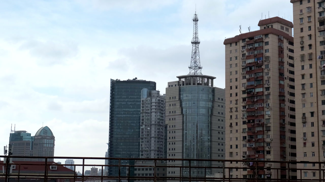 Wide of Shanghai skyline, a variety of skyscrapers and high-rise apartment buildings under a cloudy sky