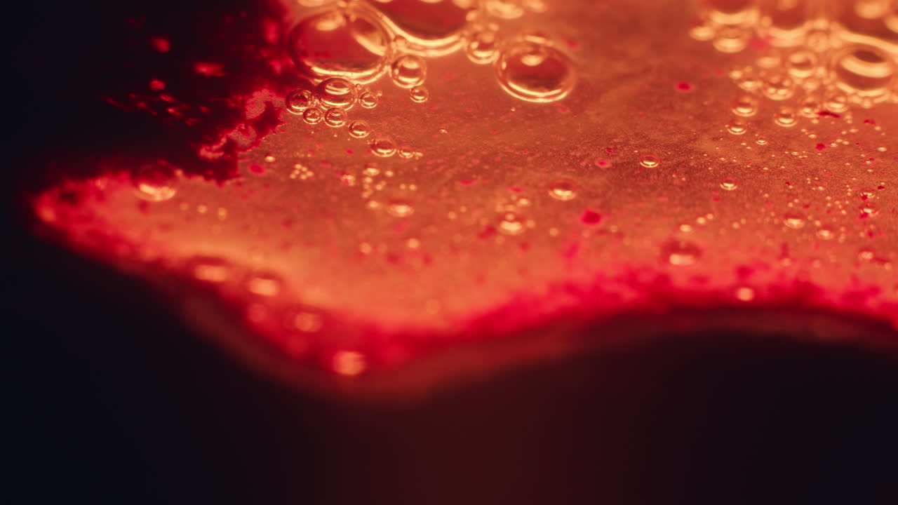 Colourful, organic, liquids macro shots buzzing and flowing