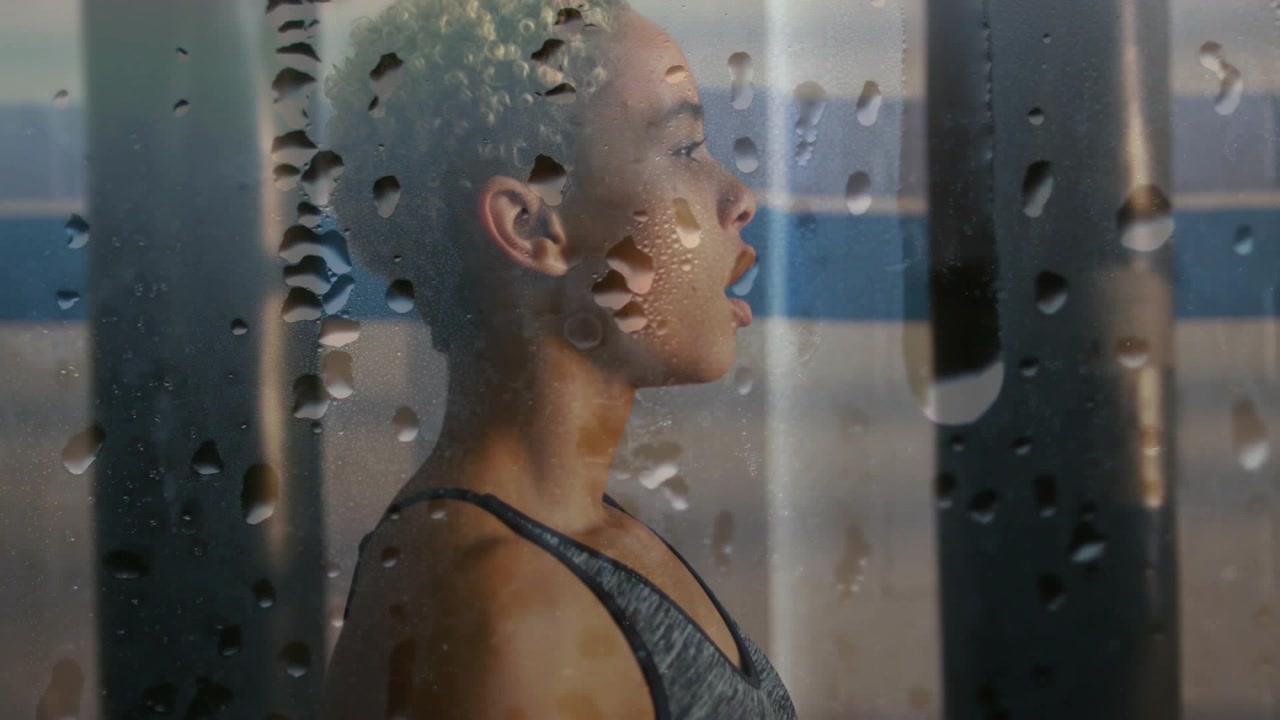 Sweaty Athlete Resting After Workout Behind Glass With Water Droplets