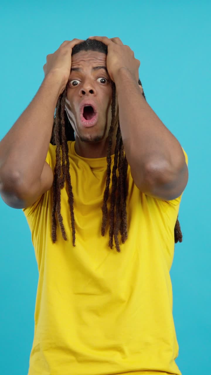 Shocked man with dreadlocks