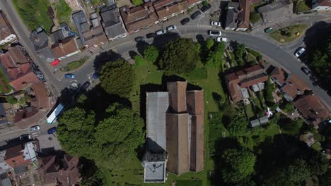 4K-birdeye-view-of-a-village-church-in-Kent,-England