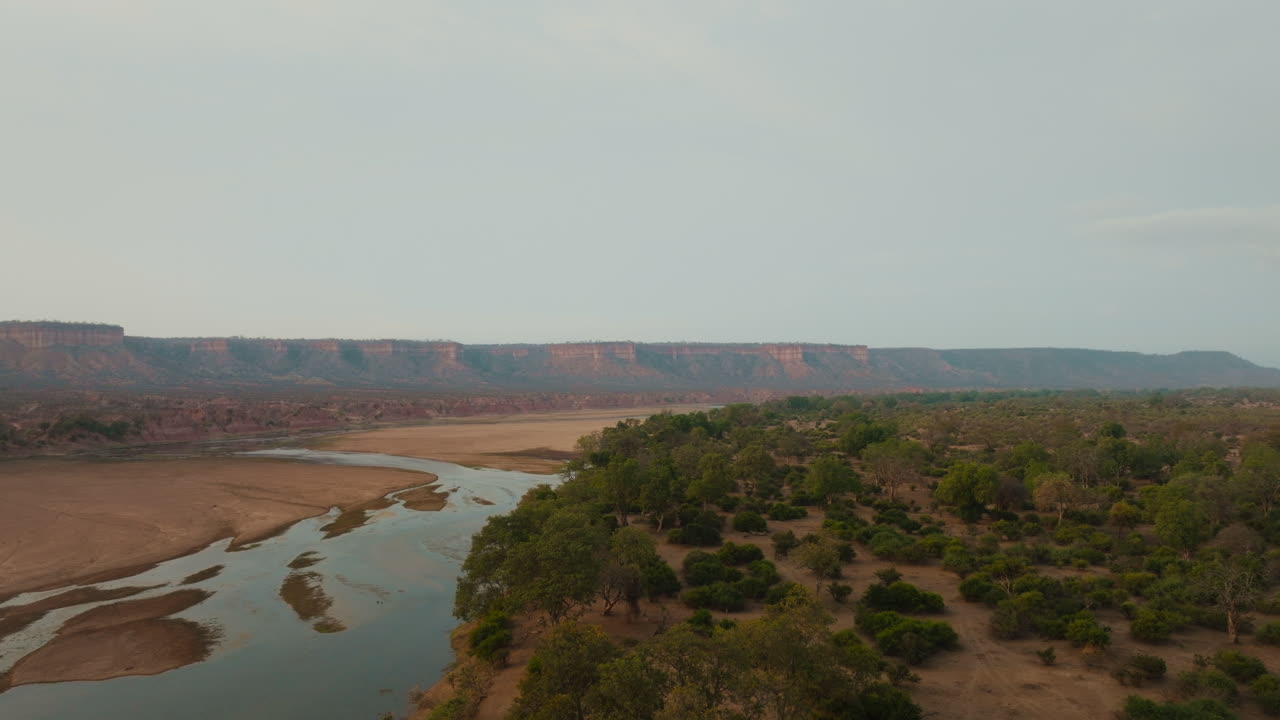 Aerial drone view of Runde River and Chilojo Cliffs in Gonarezhou Zimbabwe afternoon haze