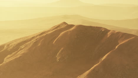 sunset over the sand dunes in the desert. aerial view