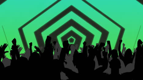 silhouetted crowd raising hands in the air with green hexagons and moving lights behind