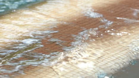 swimming pool water texture surface in slow motion