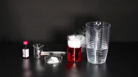 dry ice reacts with red liquid, creating vapor