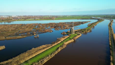 drone dolley shot of traditional windmills in kinderdijk on a sunny autumn day