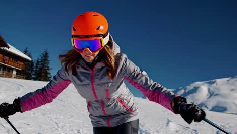 woman snowboarding on a snowy mountain slope