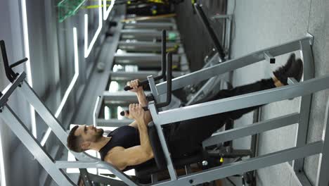 the young man raising his legs up to work for a perfect abdomen