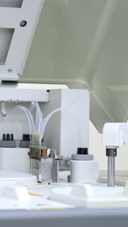 modern healthcare testing analysis carried with the help of innovative equipment. machine working at biomedical laboratory in present day hospital. vertical video