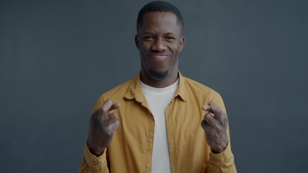 Man Crossing Fingers