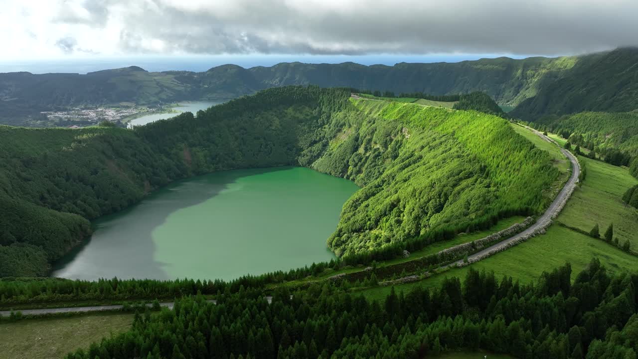 Road on rim of Santiago volcanic crater lake at Sete Cidades, S&amp;atilde;o Miguel