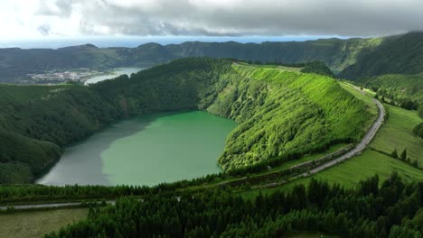 road on rim of santiago volcanic crater lake at sete cidades, são miguel