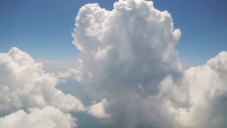 flying with clouds, watching clouds from airplane window