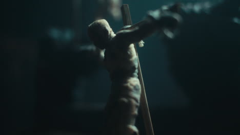 a miniature mummified dolls hanging on the gallows at night