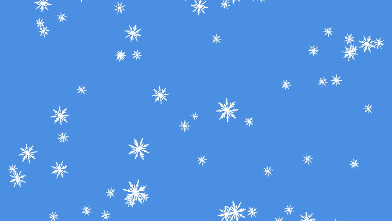 Glowing snow particles falling against blue background