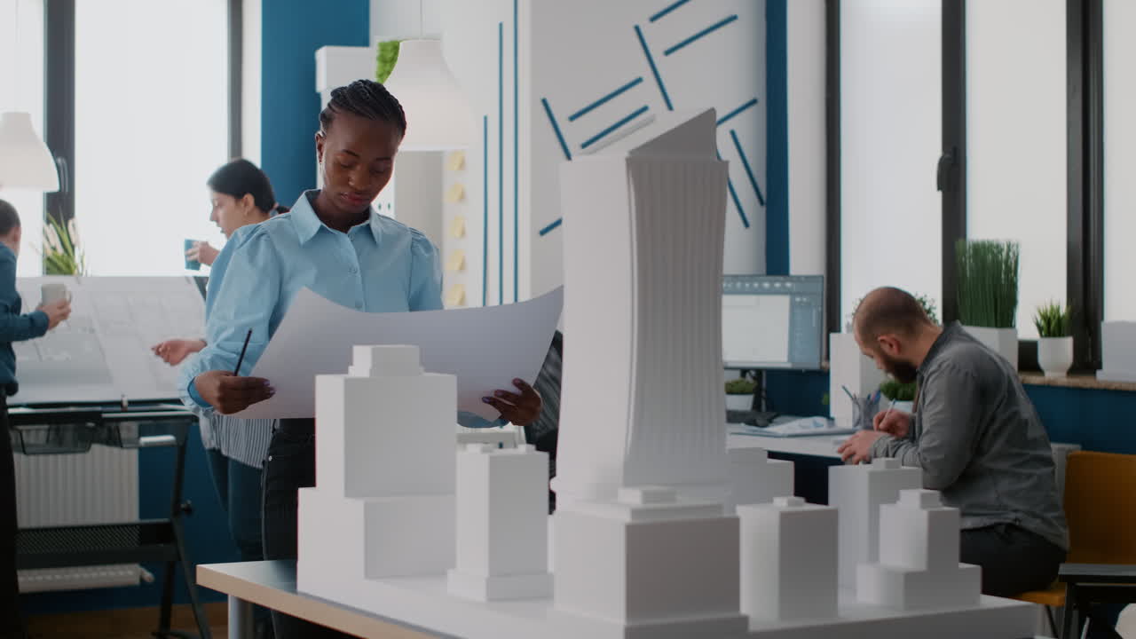 Architects collaborating on a building design in the office