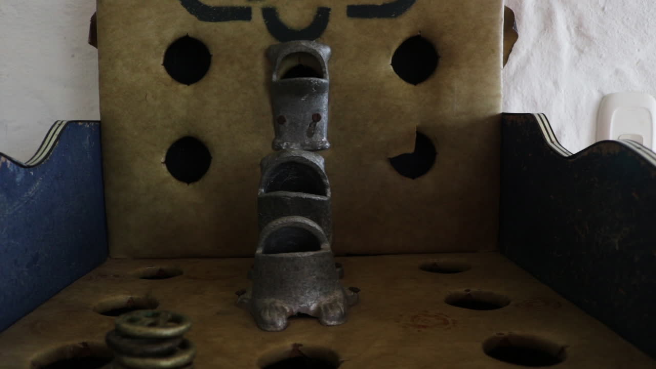 Travelling through the traditional game table called Rana or Sapo.