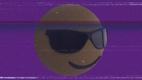 Animation-of-sunglasses-emoji-icon-over-screen-with-noise