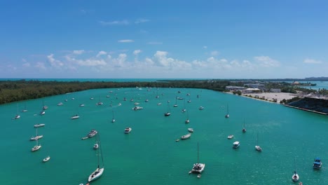 aerial view over sailboats moored at a bay at sunny virginia key, florida, usa