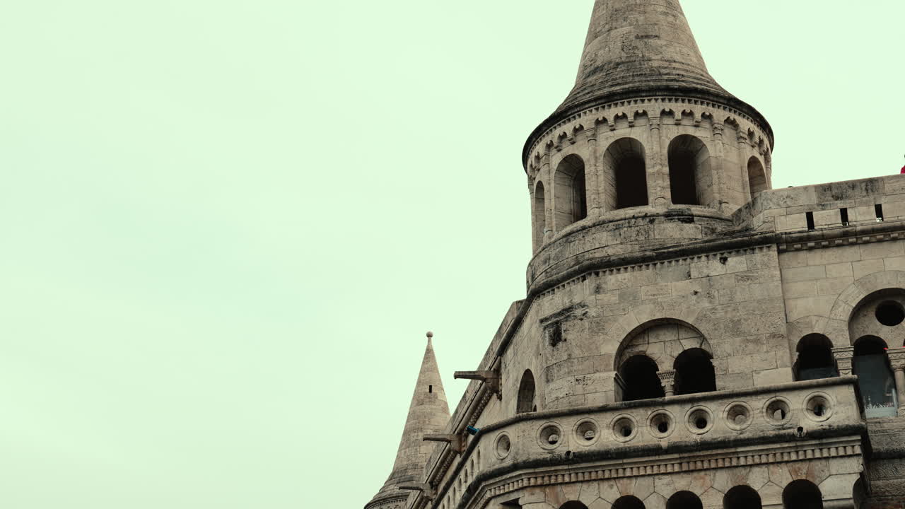 Cinematic close-up of Fisherman’s Bastion in Budapest. Beautiful stone towers, arches, and historic architecture reflecting medieval design and European heritage in the heart of Hungary