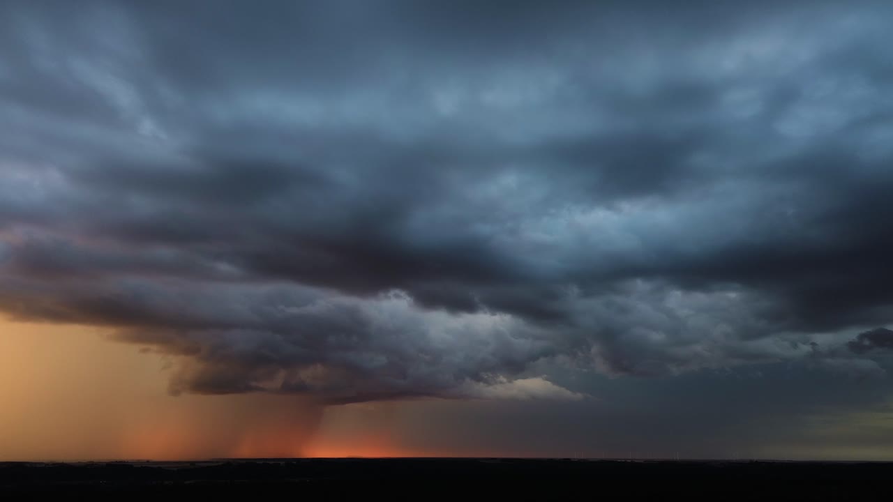 Sunset and powerful rainfall, aerial panoramic view