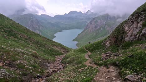 Adventurous-mountain-trail-descending-towards-lago-vannino-in-Italy