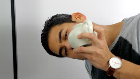 man using neti pot to clean his nasal passage