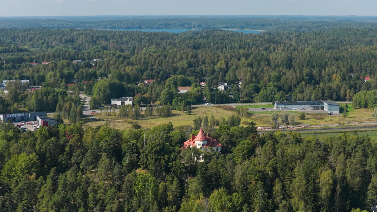 Drone circling the Majvik Villa and the road Keha 3, sunny day in Espoo, Finland