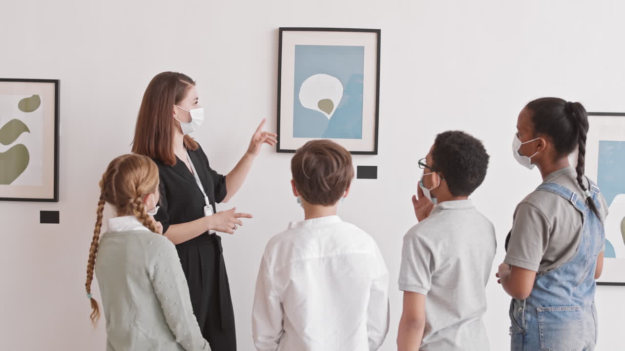 People Wearing Masks Visiting Art Gallery