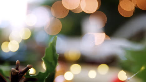 close up bauble name card holder on a dining table decorated for christmas dinner, rack focus shot