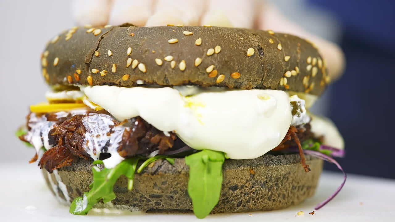 Hamburger, burger, cheeseburger. Juicy, tasty, freshly prepared. Fatty burger with fries and sauce, on a white tray. Fast food, junk food.