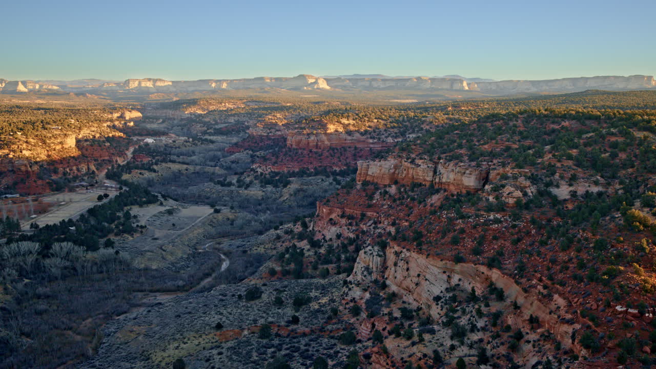Drone shot capturing the vast Canyonlands near Kanab, Utah, in the soft morning light.