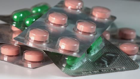 close shot of different packets of pills and medicine