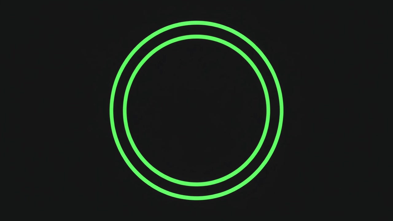 Two Concentric Green Circles Pulsing on a Dark Background