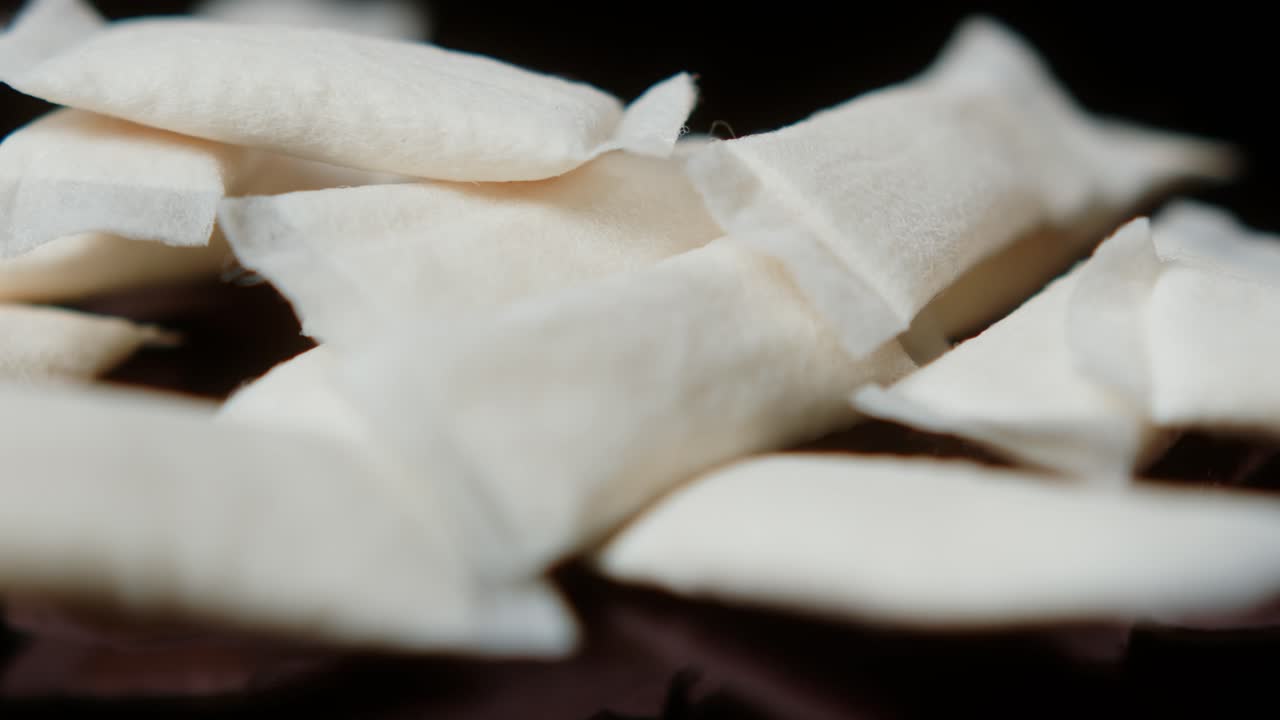 Snus nicotine tobacco close up, pack of tobacco for gum. unhealthy addiction. Man opening box with snus and taking one.