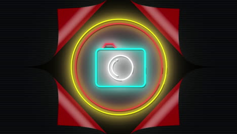 animation of flashing neon camera icon in red and yellow rings on black background