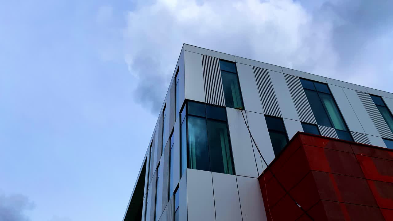 Commercial window cleaning. Working safely at height using modern water fed pole techniques